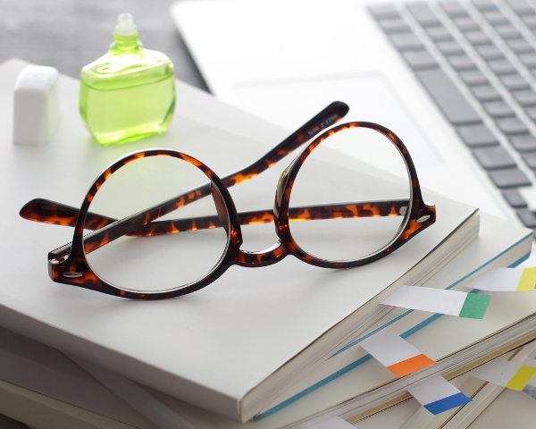 eyeglasses on a book