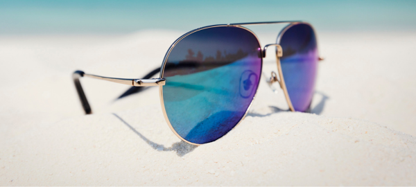 mirrored sunglasses on beach