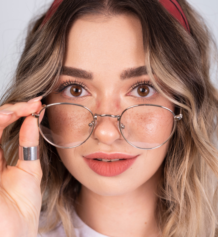 girl moving glasses down her nose