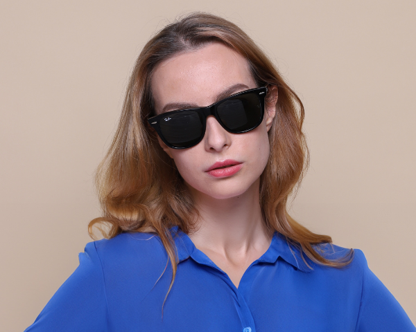 Female model wearing wayfarer sunglasses