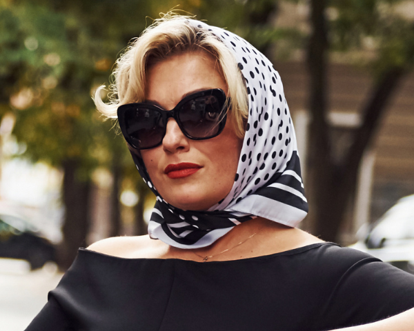 woman wearing oversized black vintage sunglasses