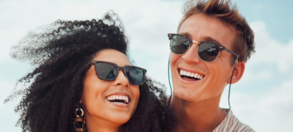woman and man wearing polarised sunglasses outdoors