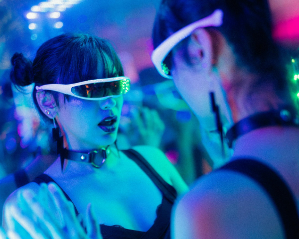 woman wearing futuristic looking wraparound mirrored sunglasses