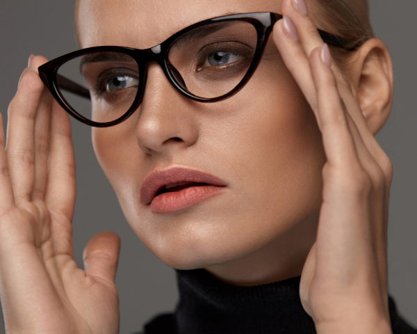 woman wearing cat eye glasses