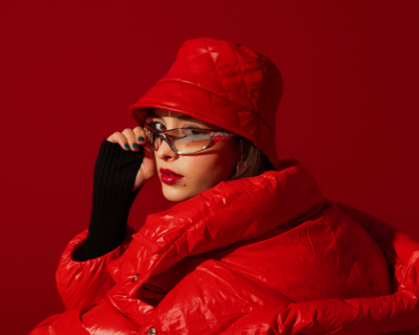 girl in all red clothes wearing reflective glasses