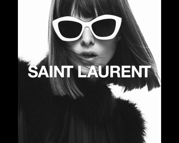 woman wearing bold white saint laurent sunglasses