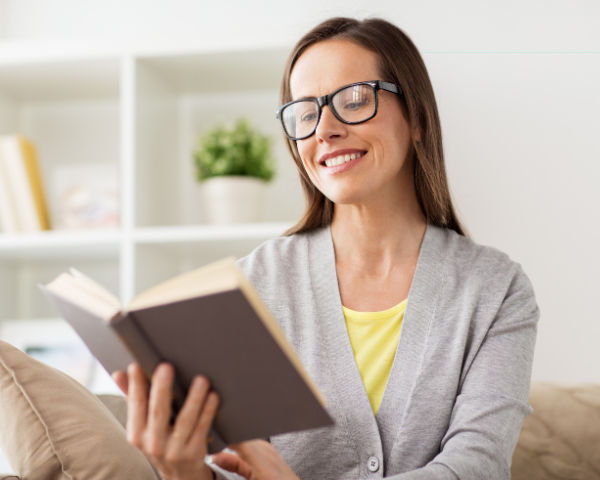 woman reading a book and wearing correct reading glasses