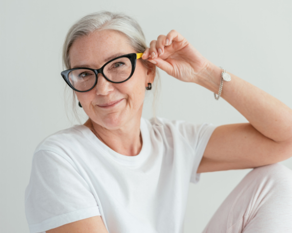 old woman wearing reading glasses