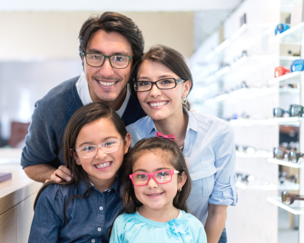 family of four wearing eyeglasses