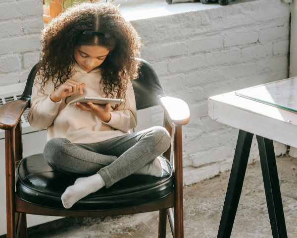 young girl using a tablet device