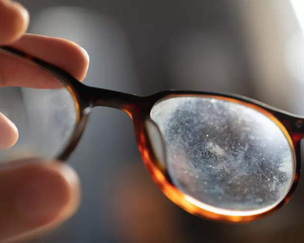 pair of glasses with scratched lenses