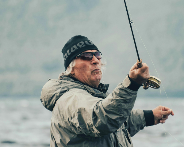 angler fishing and wearing wraparound polarised sunglasses
