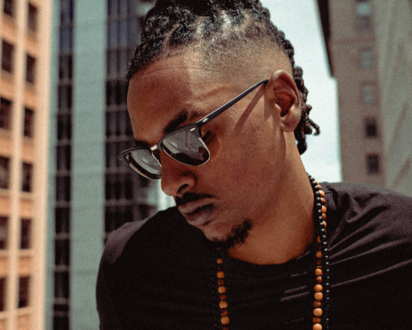 man wearing black ray ban clubmaster sunglasses