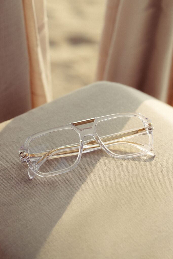 Clear frame eyeglasses on a cloth surface