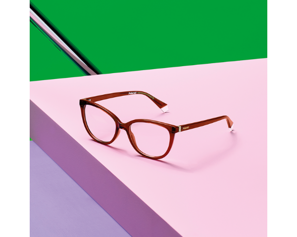 brown sunglasses in a pink table