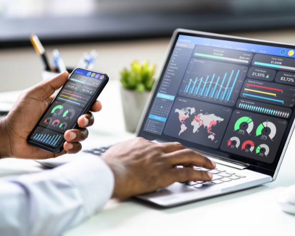 Computer and smartphone showing data