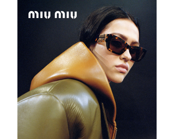 woman wearing Miu Miu sunglasses