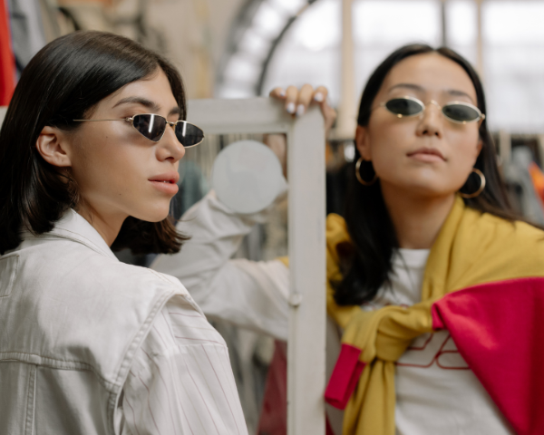 two women wearing fashion sunglasses