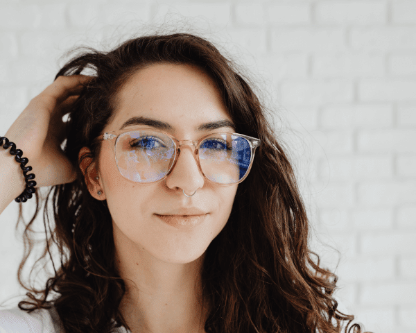 woman wearing eyeglasses with clear frame