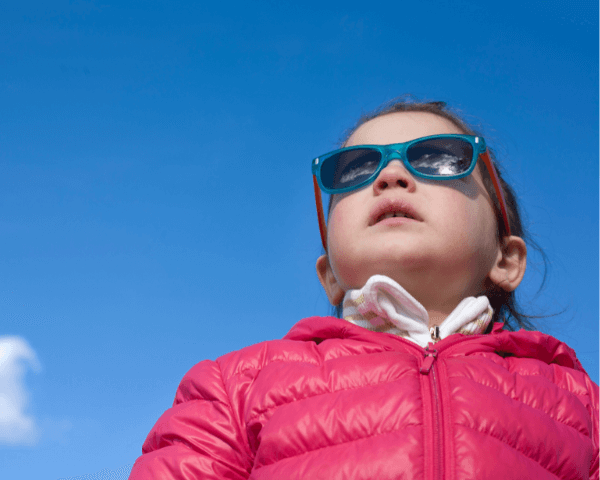 a kid wearing sunglasses
