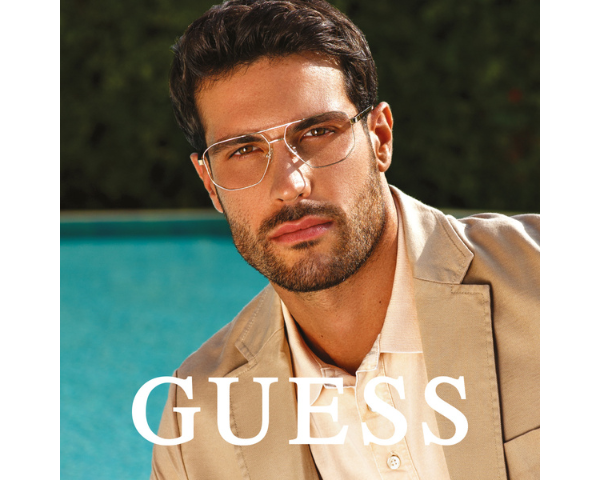 man wearing Guess eyeglasses