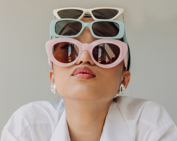 woman wearing three sunglasses