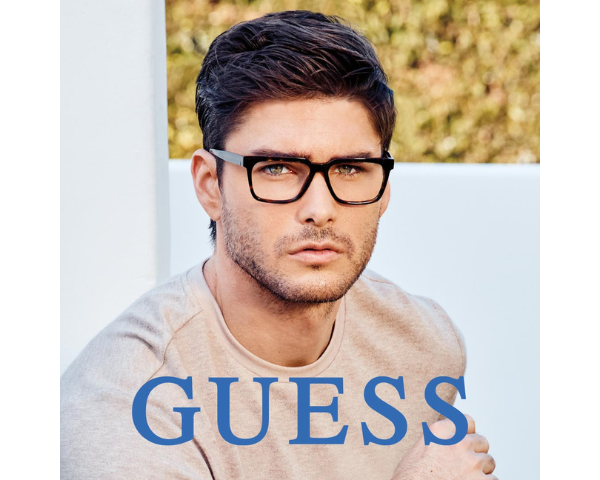 man wearing Guess eyeglasses