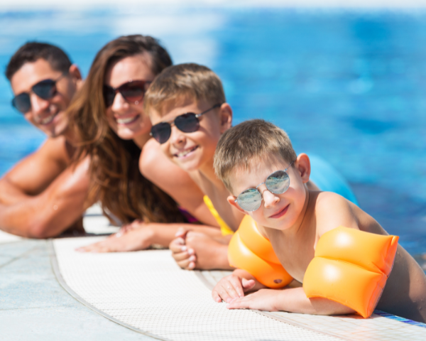 family wearing sunglasses in the pool