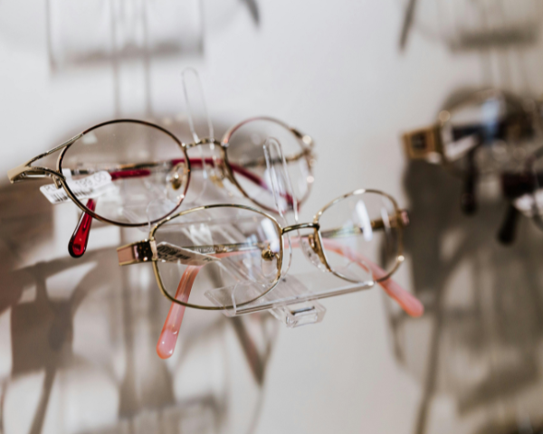 eyeglasses hung up on a display