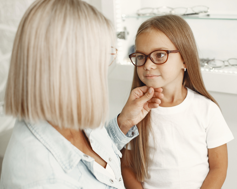 Eye doctor examining a child patient