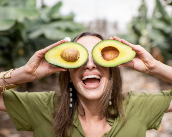 woman with avocado fruit
