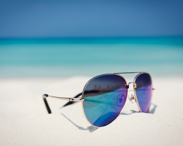 mirrored glasses on beach