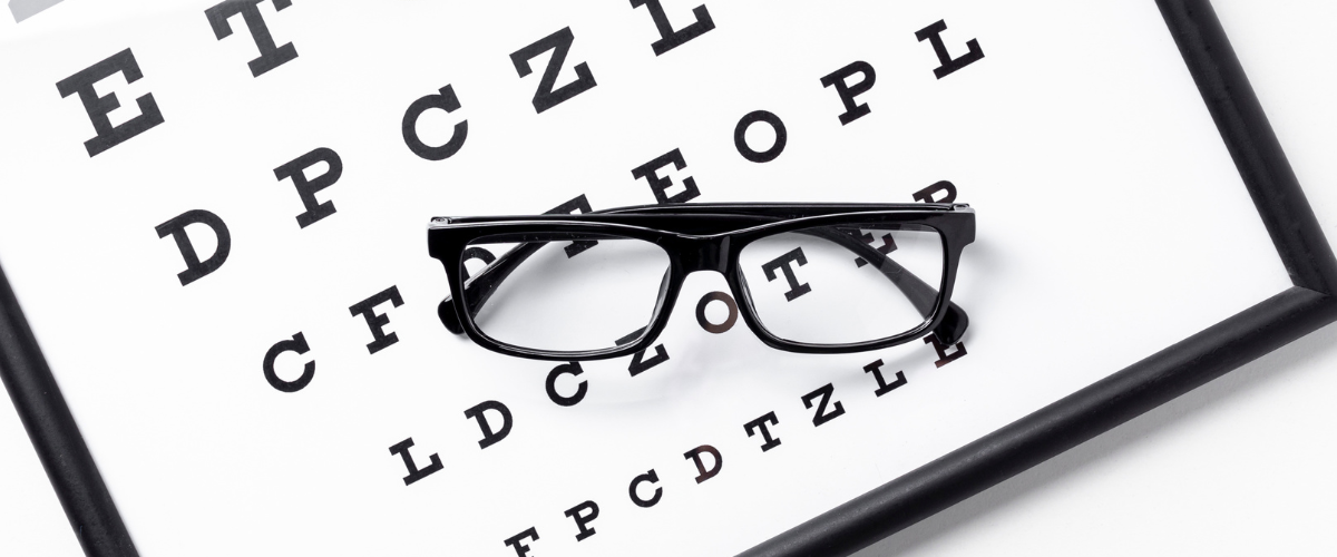 glasses sitting on eye chart