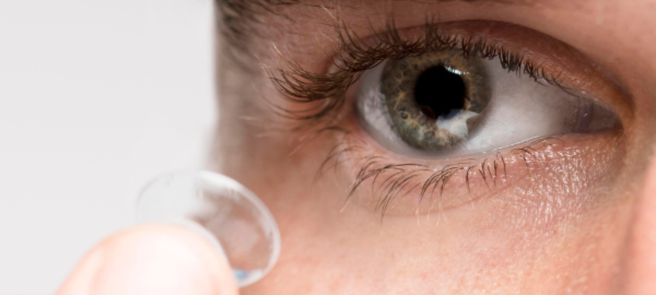 man putting in contact lens