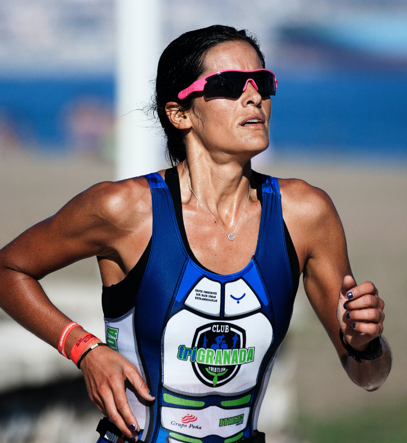 woman running wearing sports sunglasses