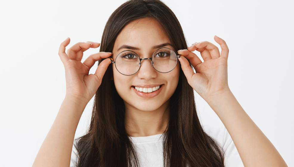 woman wearing round metal glasses