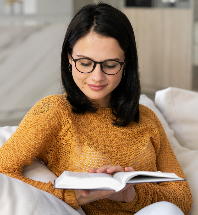 woman wearing glasses and reading