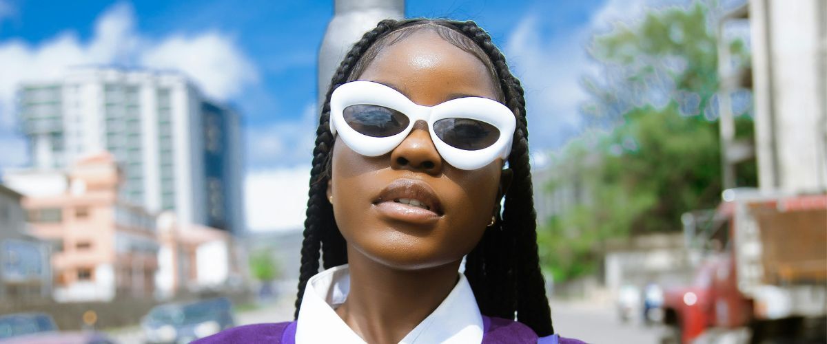 close-up of a woman wearing white loewe sunglasses
