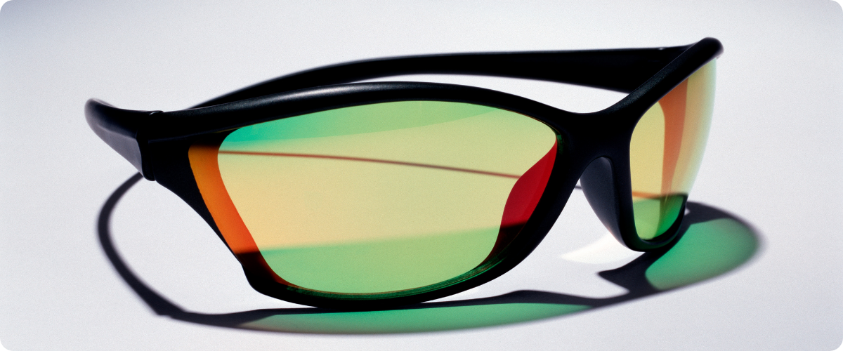 pair of green-tinted wraparound sunglasses
