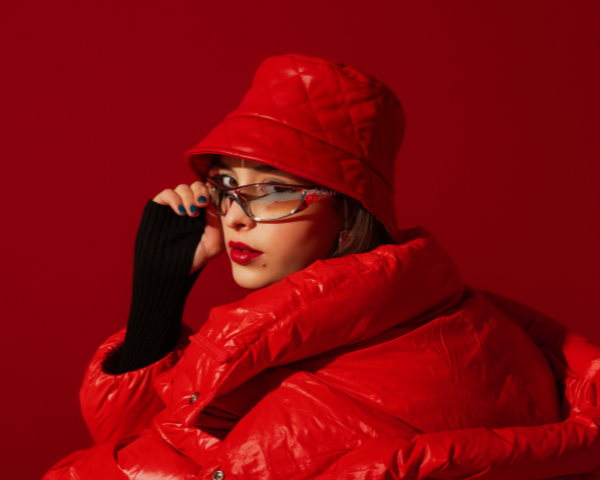 girl in all red clothing wearing mirrored glasses