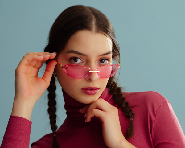 girl wearing pink rimless glasses