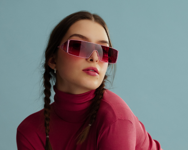 girl wearing oversized pink sunglasses