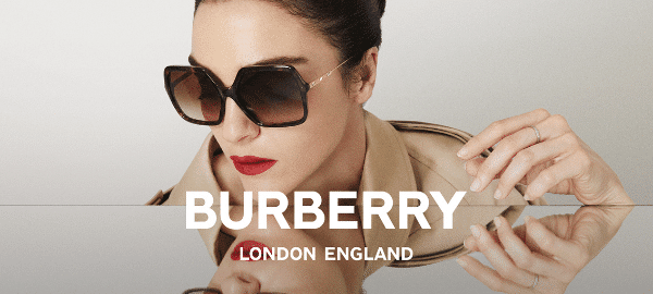 fashionable female model wearing black burberry sunglasses and red lipstick