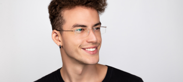 youthful man wearing rimless glasses