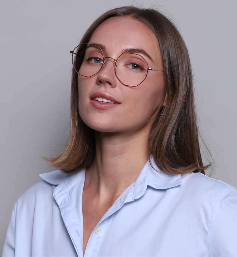 model wearing thin frame glasses
