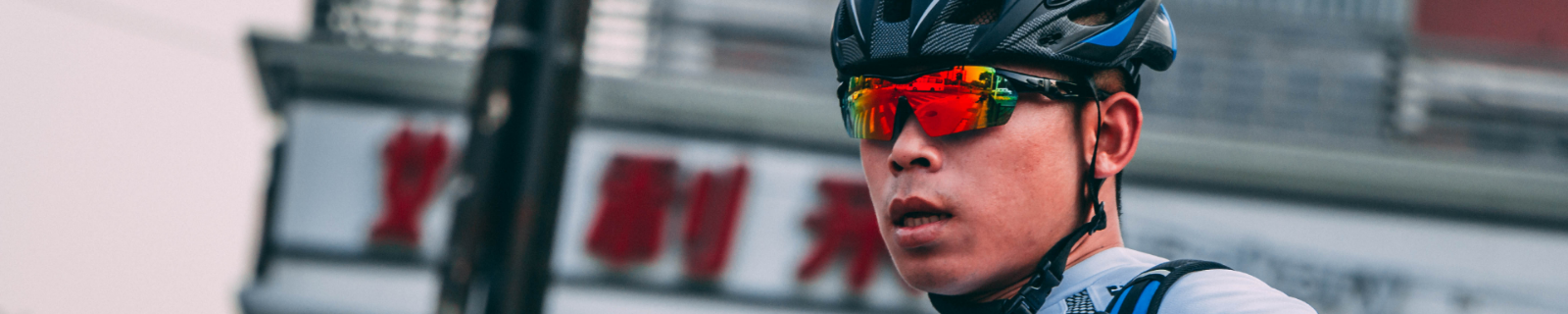 Man in cycling gear with tinted glasses