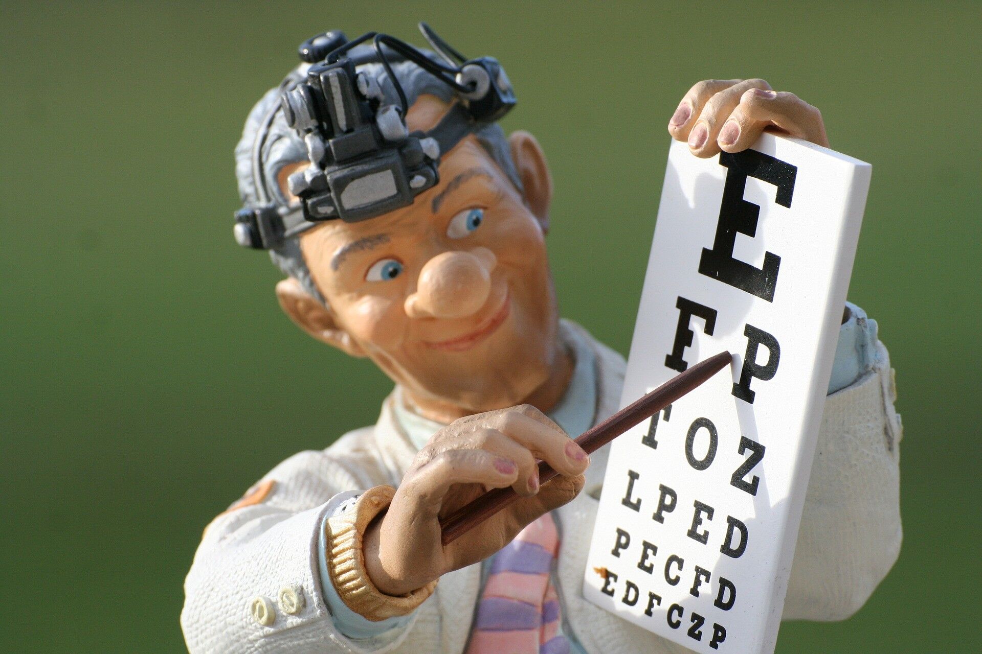 Toy optician indicating an eye chart