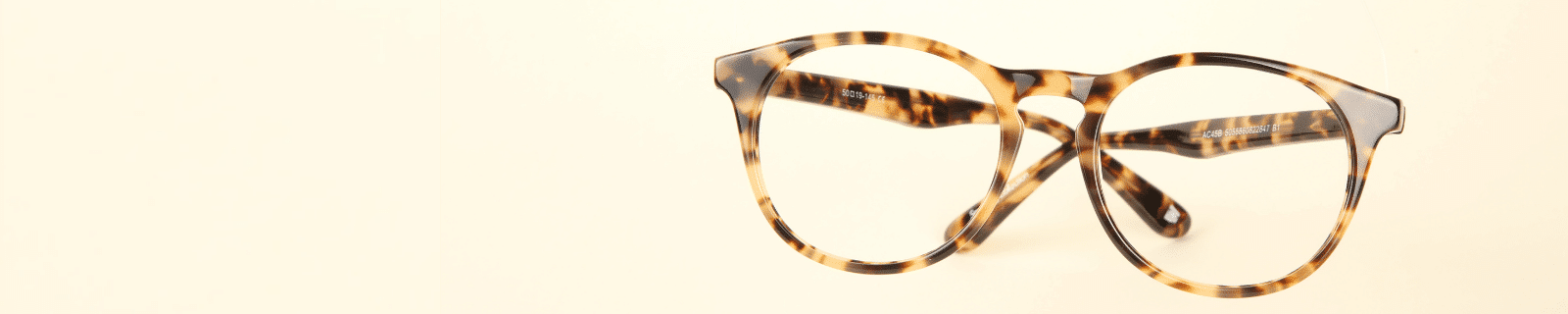flat lay shot of tortoiseshell print horn rimmed glasses