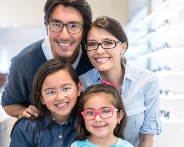 Parents and two girls wearing glasses