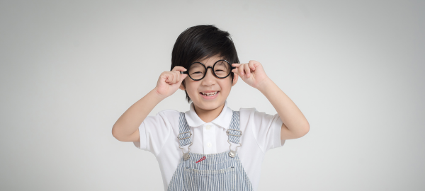 Boy wearing glasses and smiling